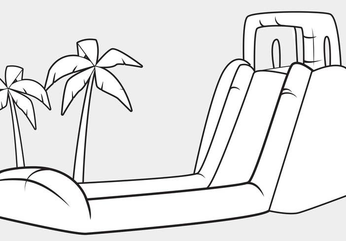 Inflatable slide next to two palm trees