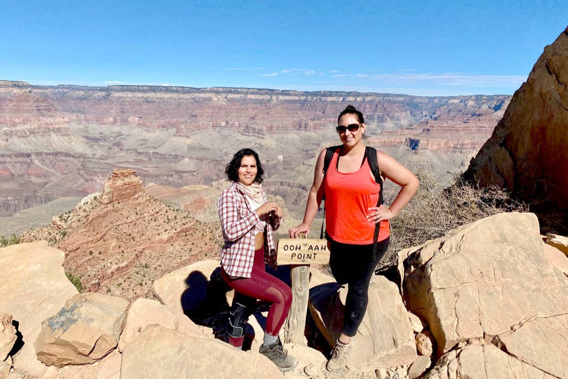 Noemi (left) and friend (right) stand atop the 'Ooh Aah Point' at the Grand Canyon in Arizona.