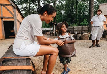 family enjoying activities at Jamestown Settlement® near Williamsburg Resort, VA.