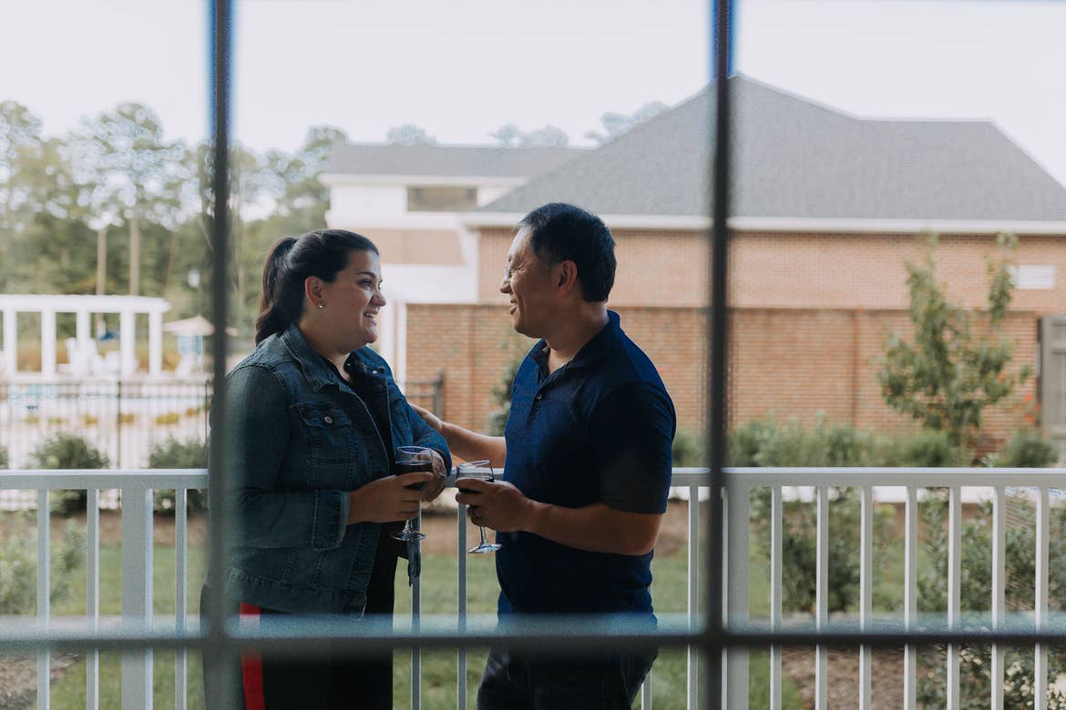 Featured Contributor, Angelica Kajiwaraand her husband enjoy drinks outside on the patio at our Williamsburg resort in Williamsburg, Virginia.