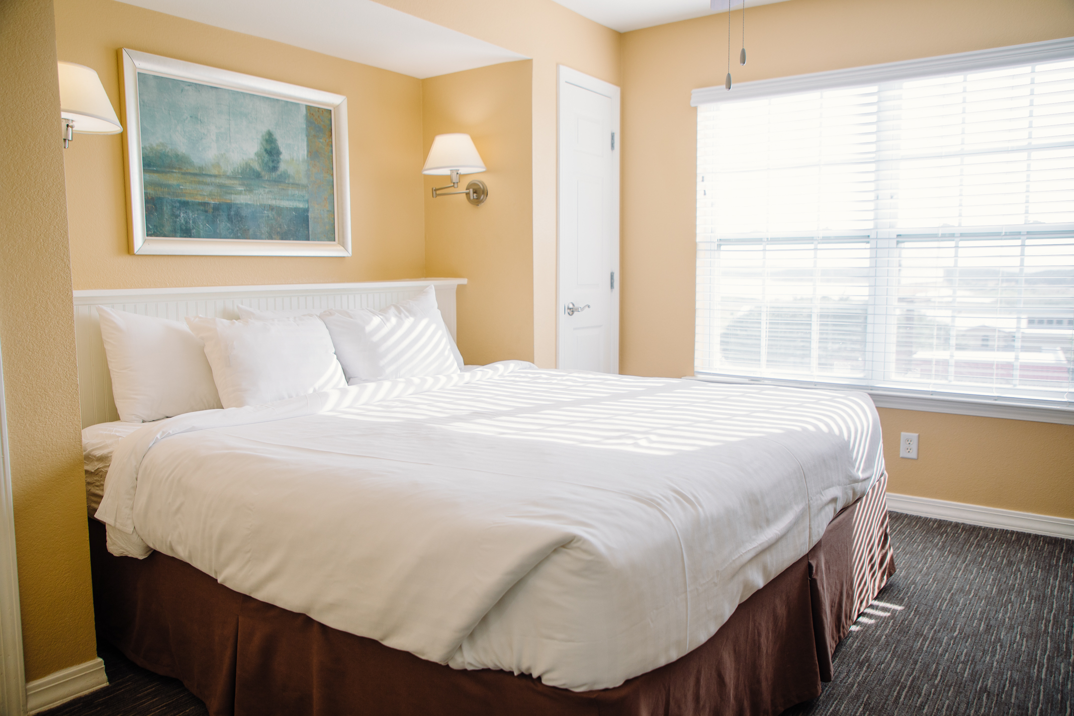 King size bed in a one-bedroom ambassador villa at the Hill Country Resort in Canyon Lake, Texas.