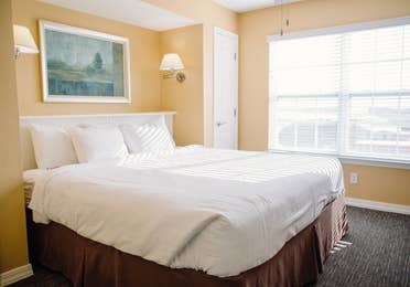 King size bed in a one-bedroom ambassador villa at the Hill Country Resort in Canyon Lake, Texas.