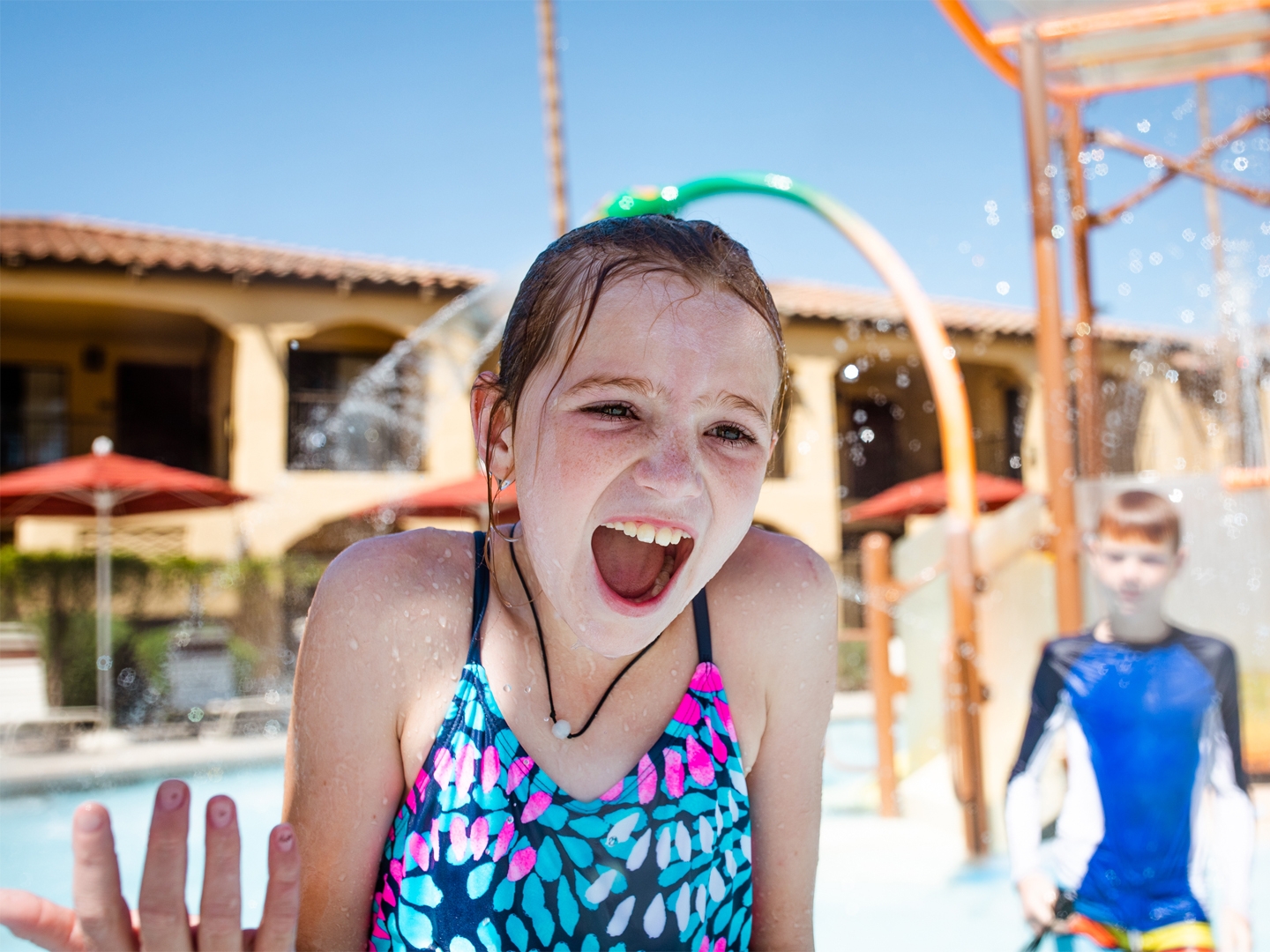 Child playing in water feature