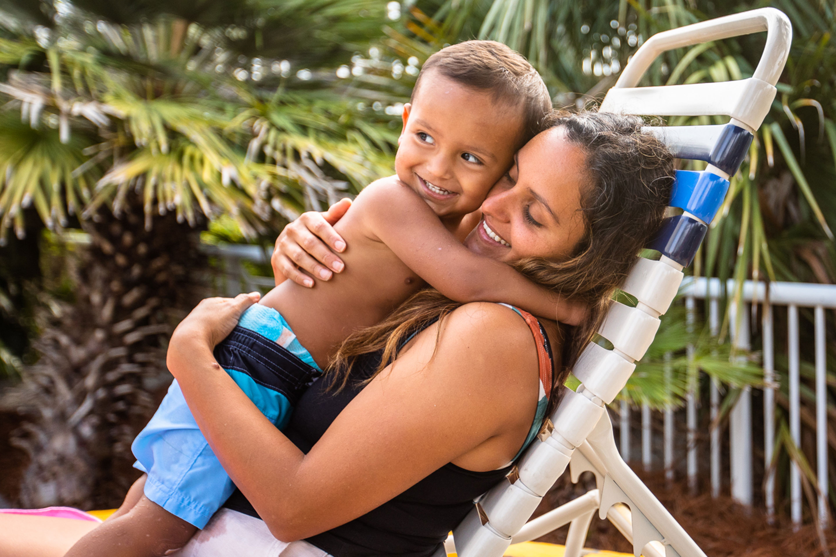 Author, Brenda Rivera Sterns (right) holds her son (left) in the pool chair at our South Beach Resort in Myrtle Beach, South Carolina.