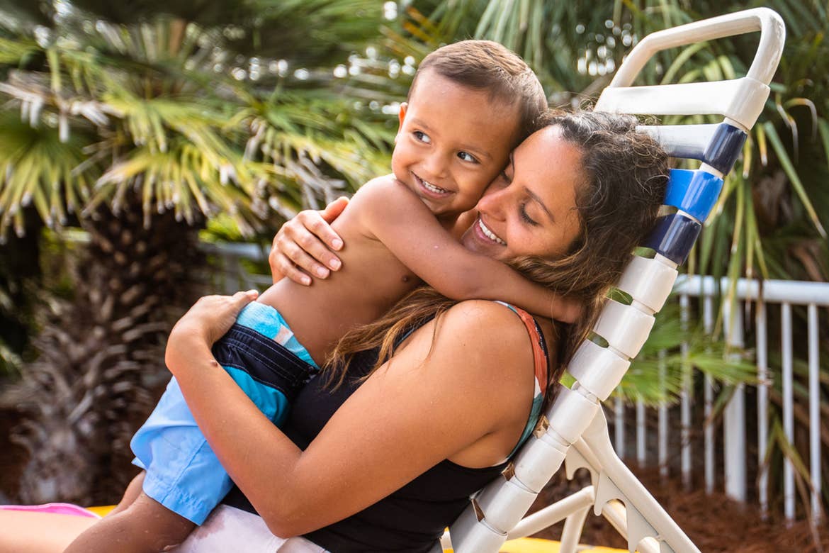 Author, Brenda Rivera Sterns (right) holds her son (left) in the pool chair at our South Beach Resort in Myrtle Beach, South Carolina.