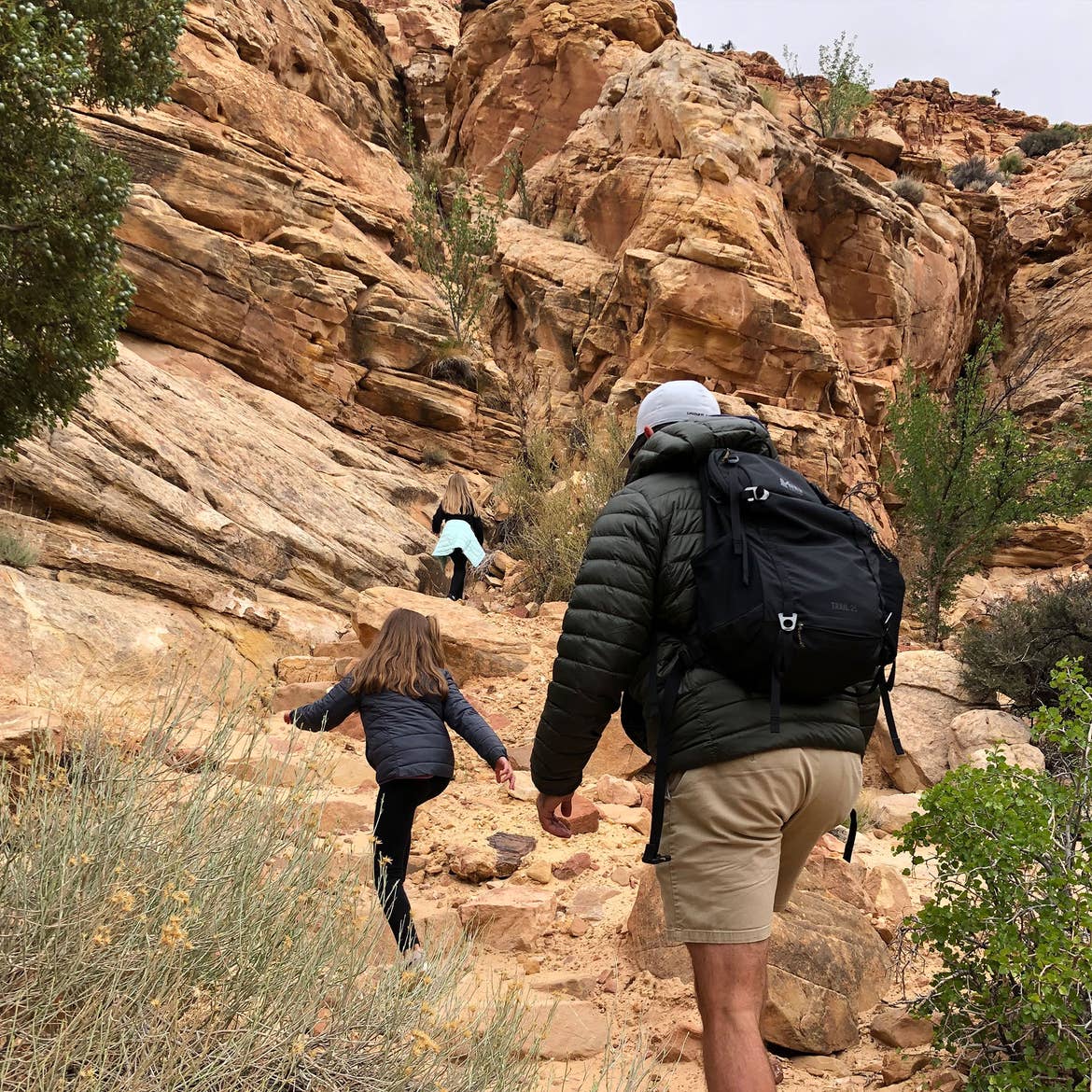 Kyler and Kyndall climb ahead of Josh up the Capitol Gorge Trail.