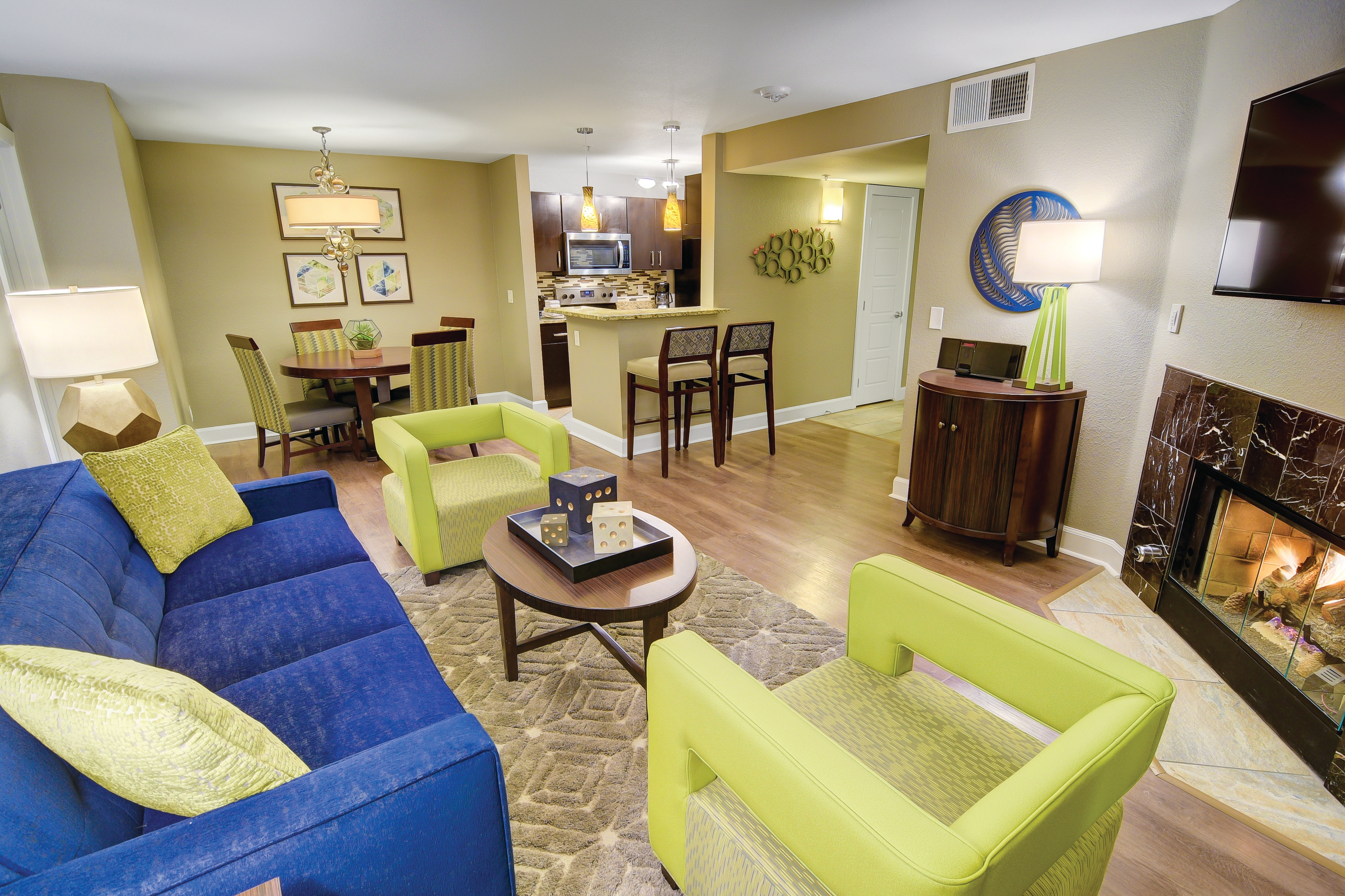 Living room, dining area, and kitchen in a two-bedroom villa at Desert Club Resort in Las Vegas