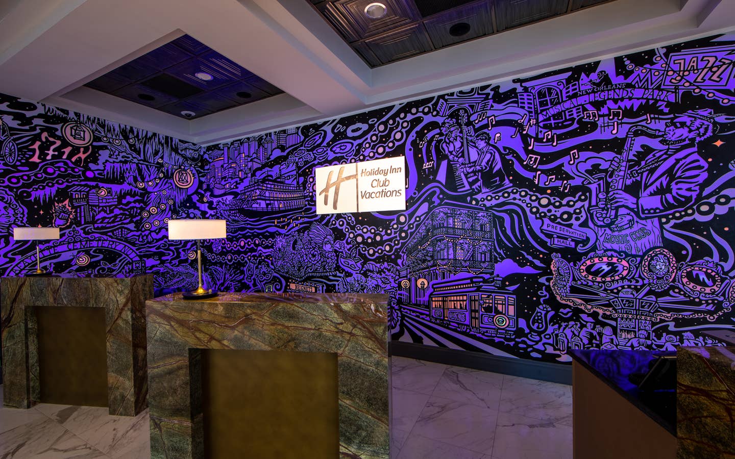 A mural with animated projection mapping in various colors of purple, orange, yellow and magenta featured in the lobby of our resort in New Orleans, Louisiana.
