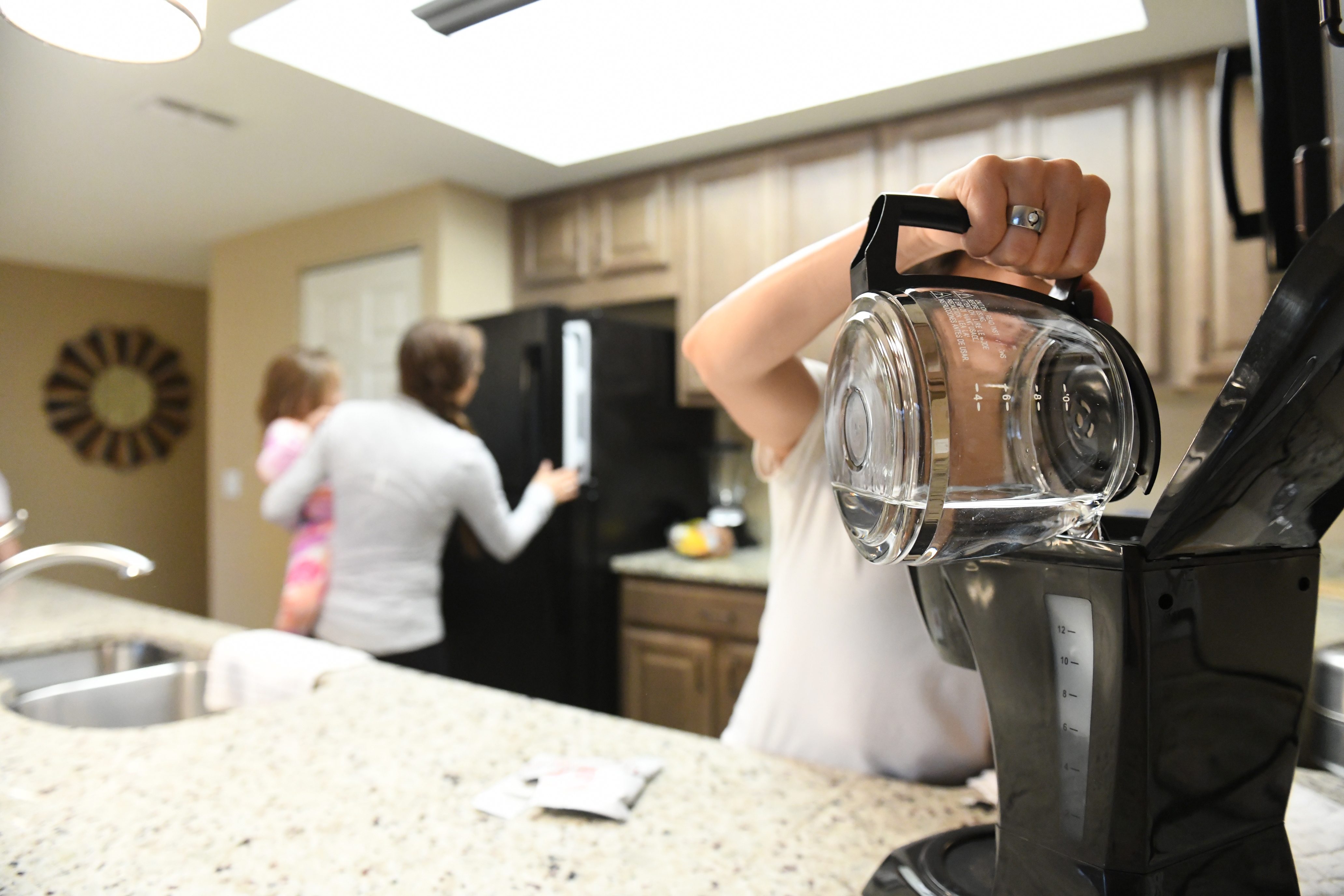 Raff's family using the kitchen in their Orange Lake Resort villa