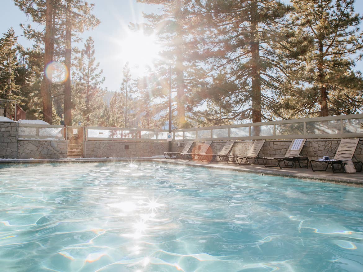 Outdoor pool surrounded by trees at Tahoe Ridge Resort in Stateline, Nevada.