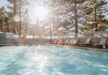 Outdoor pool surrounded by trees at Tahoe Ridge Resort in Stateline, Nevada