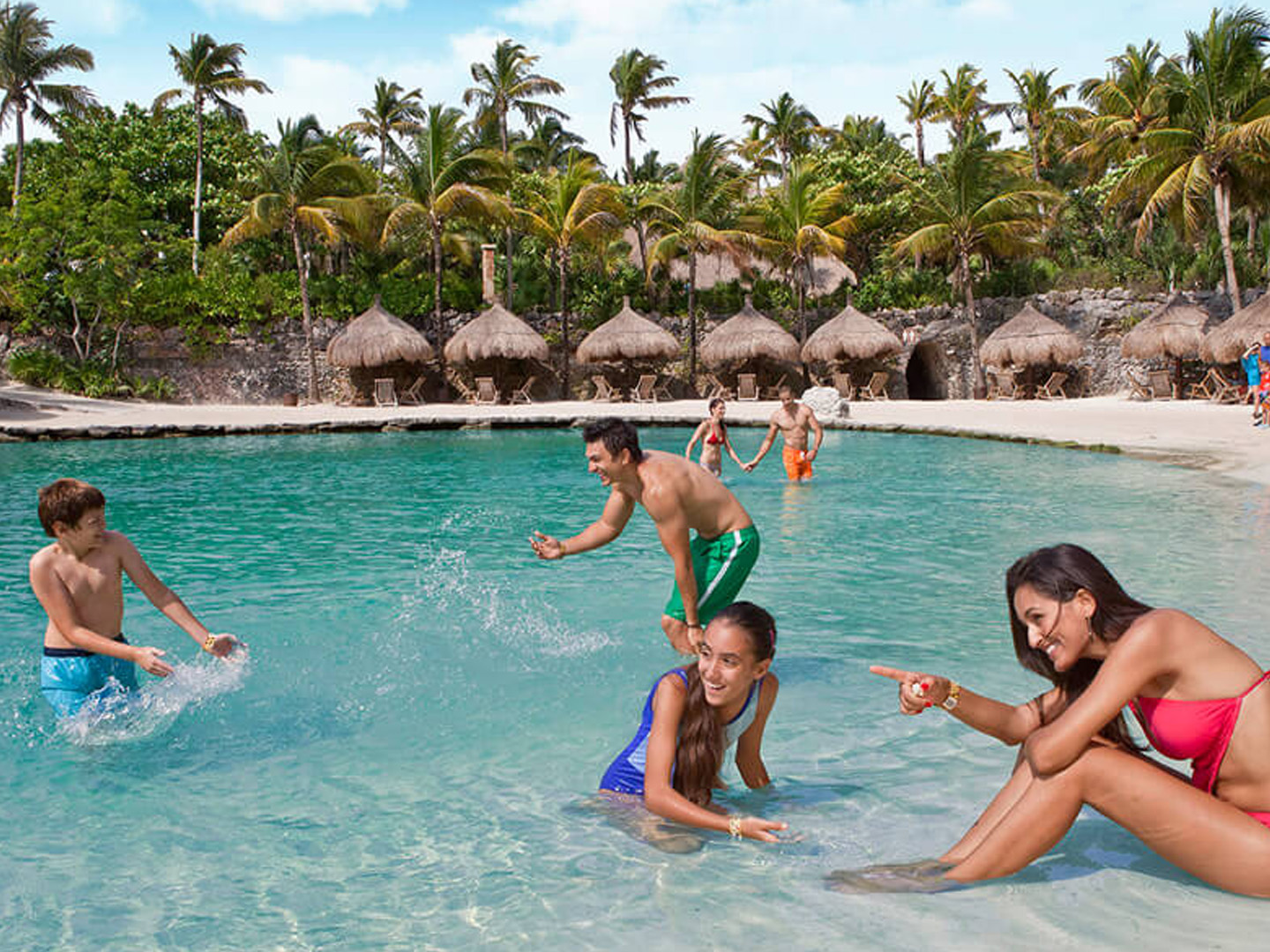 family enjoying pool