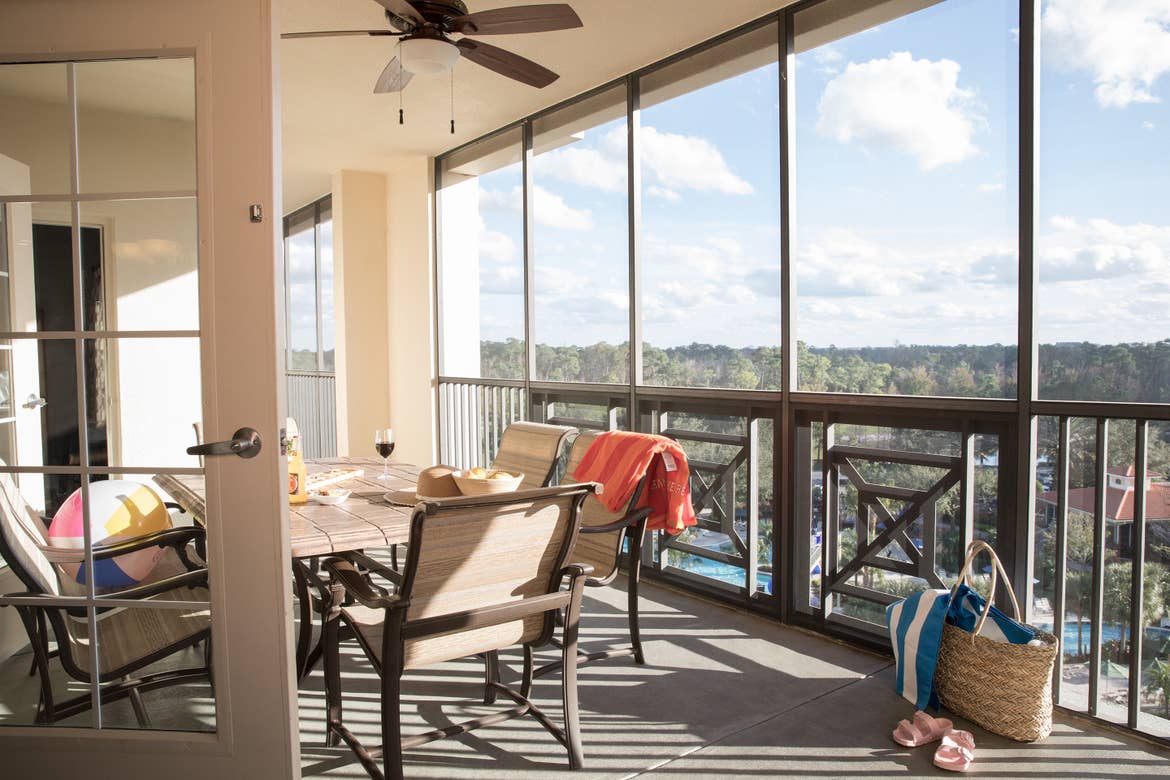 Furnished balcony with table and six chairs in a villa in River Island at Orange Lake Resort near Orlando, Florida