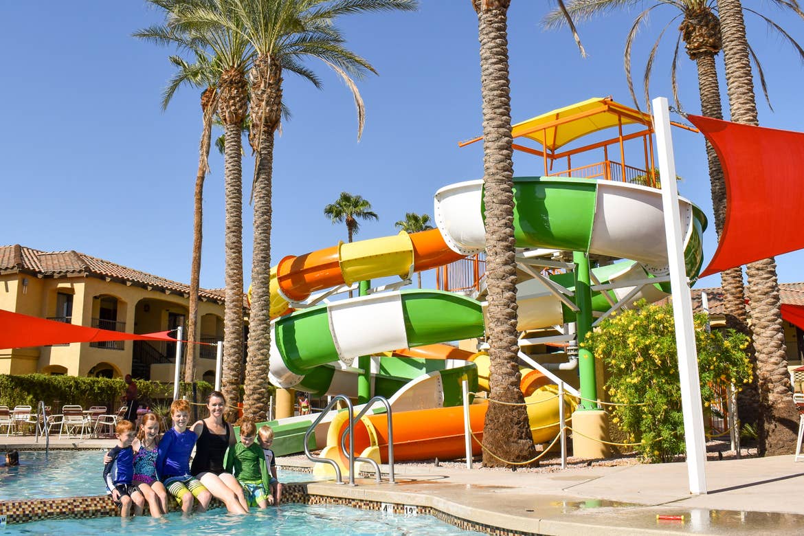 Author, Jessica Averett, and her family sit poolside at our Scottsdale Resort in Arizona.
