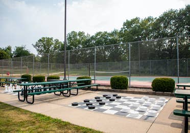 Tennis court and life-sized checkers at Fox River Resort in Sheridan, Illinois.