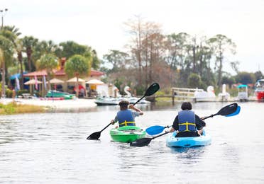 Two people kayaking at Orange Lake Resort.