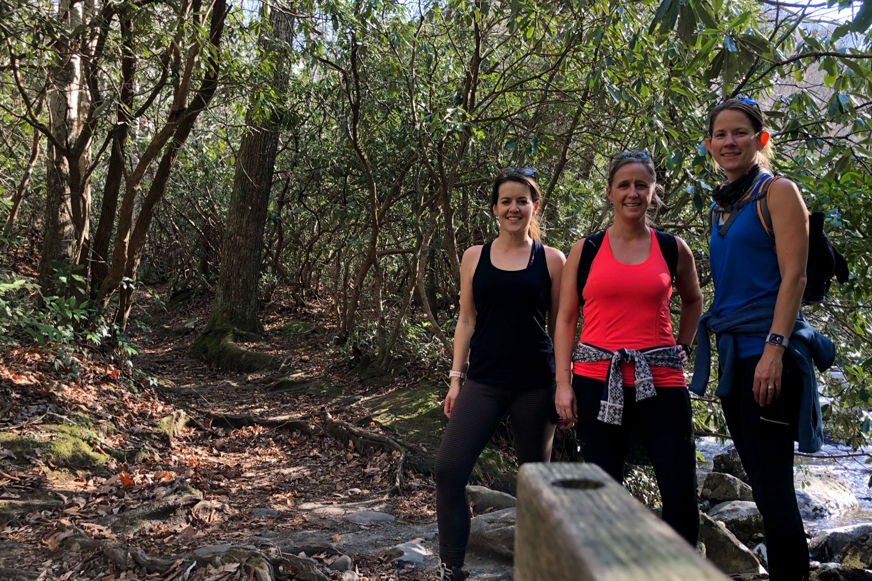 Featured Contributor, Jennifer C. Harmon (left) and her two girlfriends wear sunglasses in the forest.