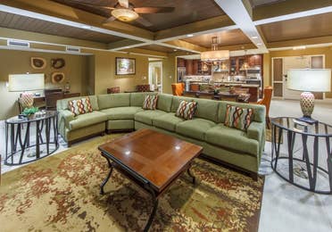 Living room with sectional couch in a Signature Collection villa at Smoky Mountain Resort in Gatlinburg, Tennessee.