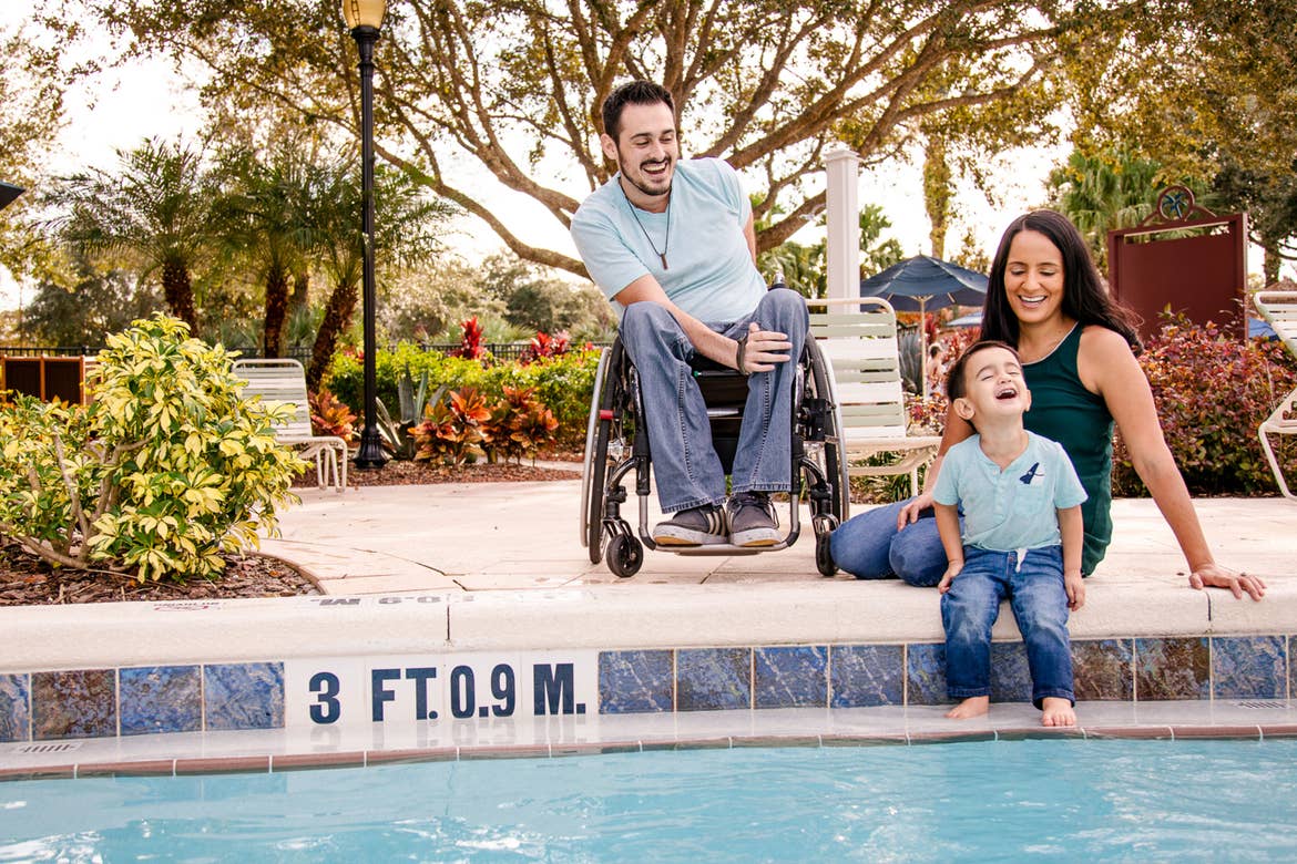 Author, Danny Pitaluga (left), his wife, Val (right) and son, Joey (middle), sit alongside the edge of our pool at our Orange Lake Resort located in Orlando, Florida.