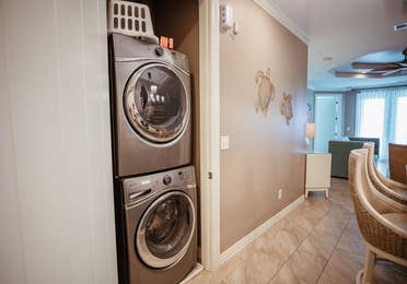 Washer and dryer machines in a two-bedroom Signature Collection villa at Galveston Seaside Resort.