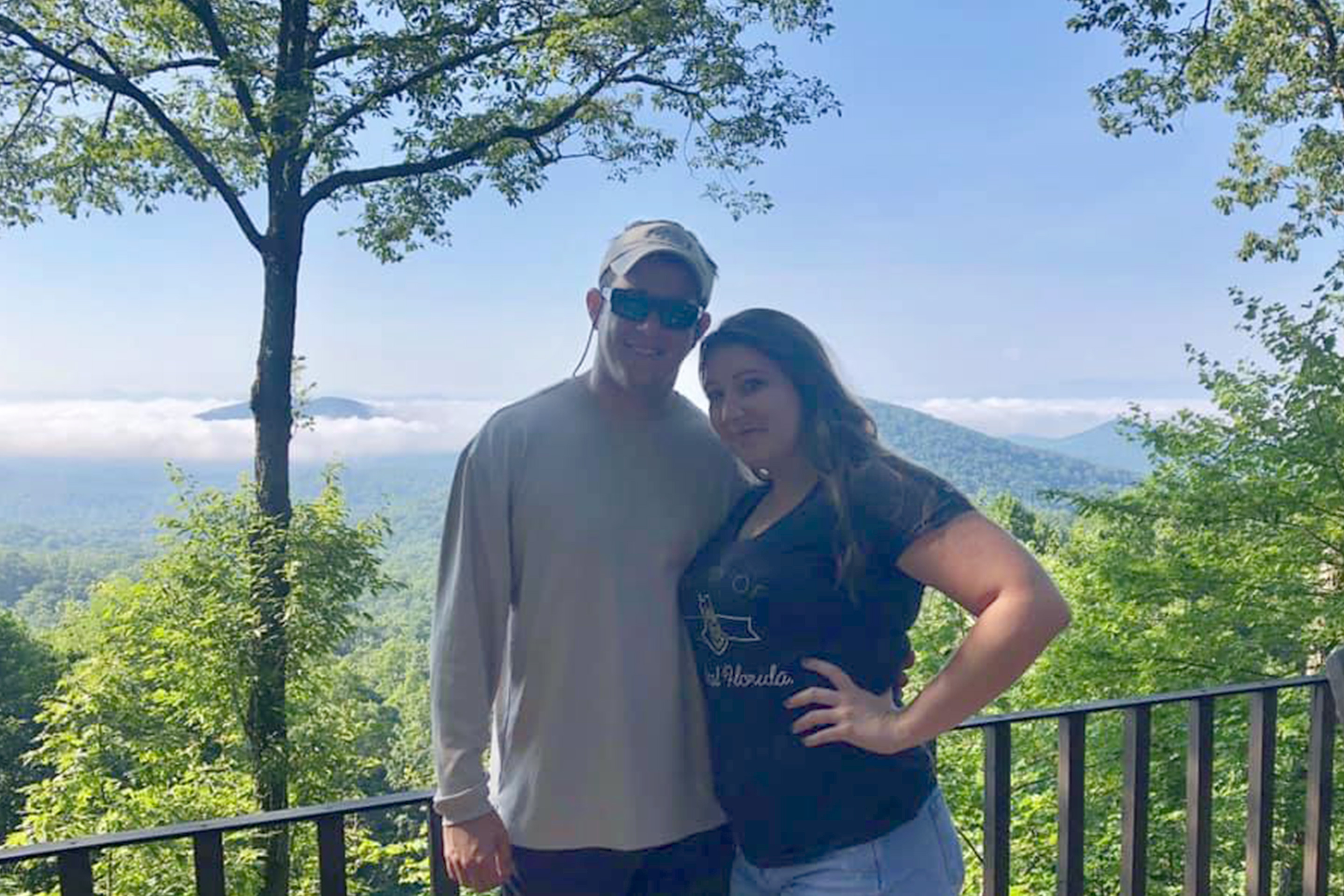 Featured Contributor, Tori Ferrante (right) and her husband (left) pose in front of the Blue Ridge Mountains in Murphy, NC.