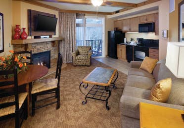 Living room and kitchen area in a villa at Smoky Mountain Resort in Gatlinburg, Tennessee.