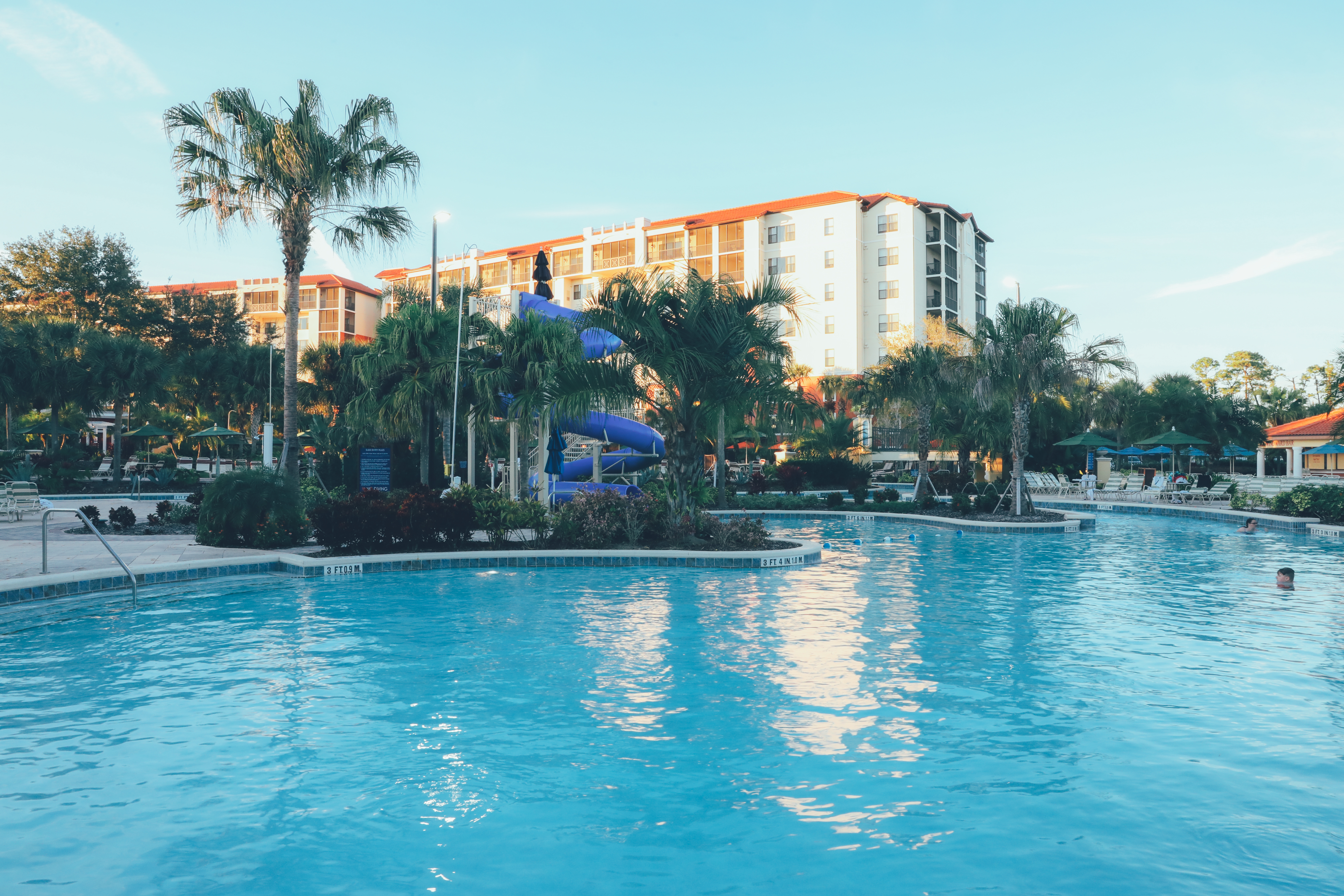 Pool view with water slide and villa tower in background in River Island at Orange Lake Resort near Orlando, Florida