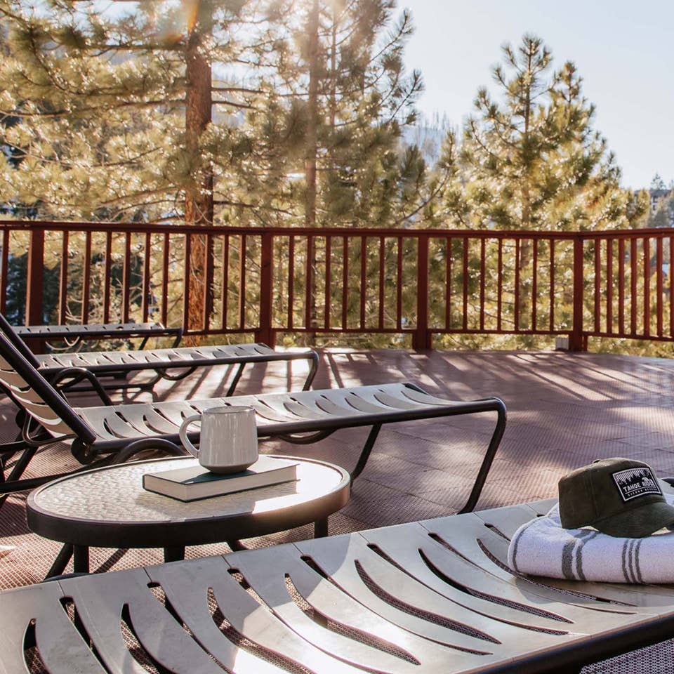 Balcony with pool chairs looking onto mountains at Tahoe Ridge Resort in Stateline, Nevada.