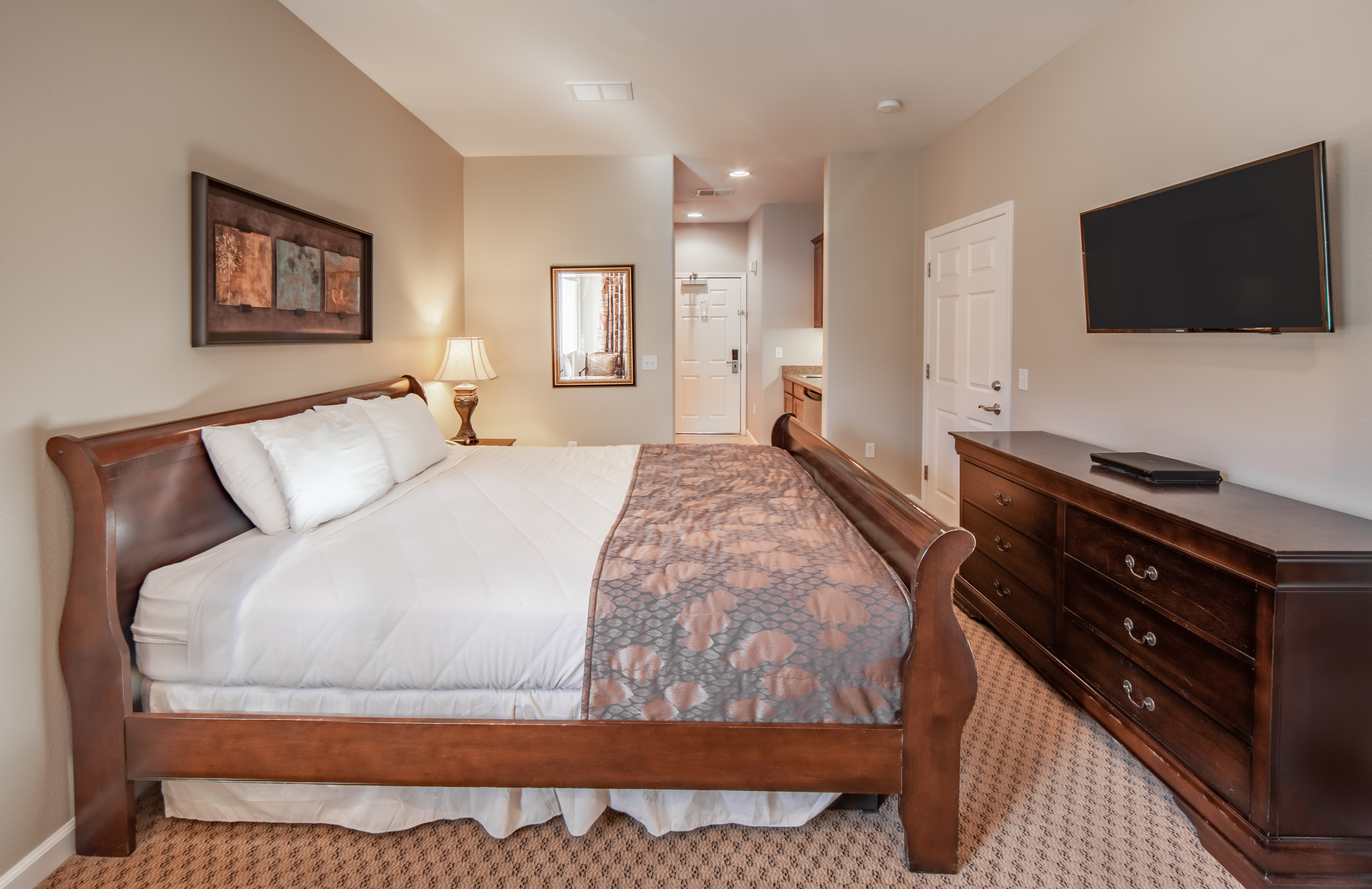 Bedroom with flat-screen TV in a two-bedroom villa at David Walley's Resort in Genoa, Nevada