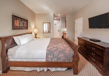 Bedroom with flat-screen TV in a two-bedroom villa at David Walley's Resort in Genoa, Nevada