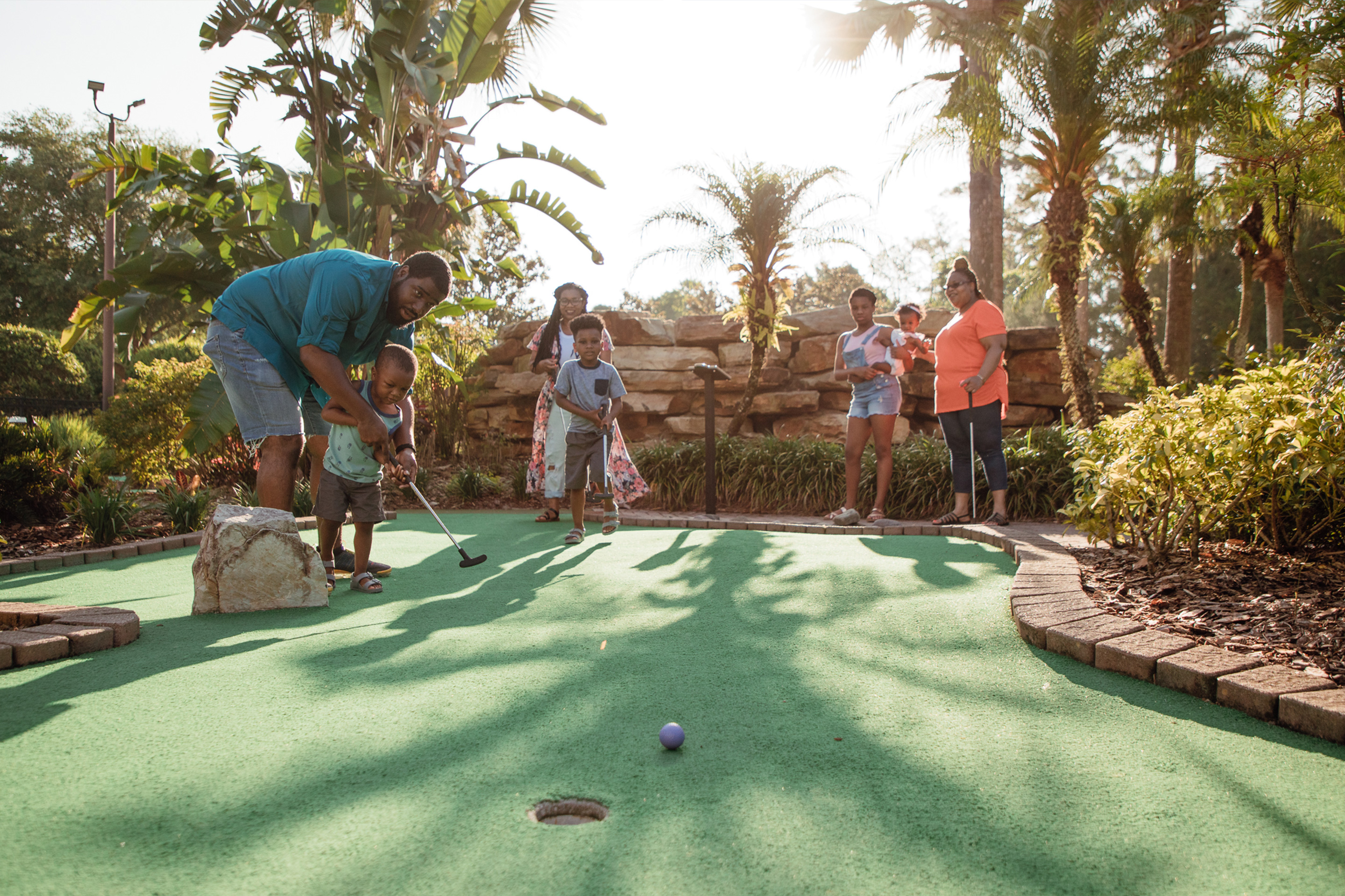 The Godfrey family of seven enjoy a round of mini golf at our Orange Lake Resort located in Orlando, FL.