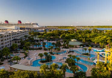 Aerial view of pool with cruise ship in background at Cape Canaveral Beach Resort in Florida.