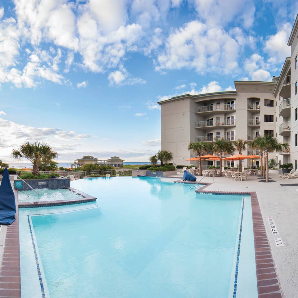 Outdoor infinity pool overlooking the beach at Galveston Beach Resort in Texas.