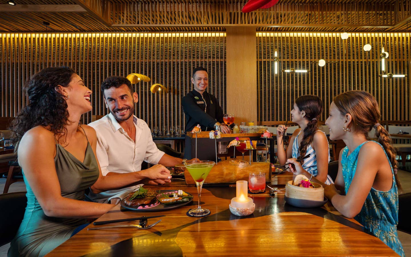 Family of four enjoy all-inclusive dining at The Royal Haciendas.