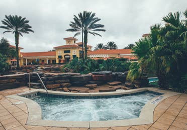 Hot tub surrounded by palm trees in River Island at Orange Lake Resort near Orlando, Florida.