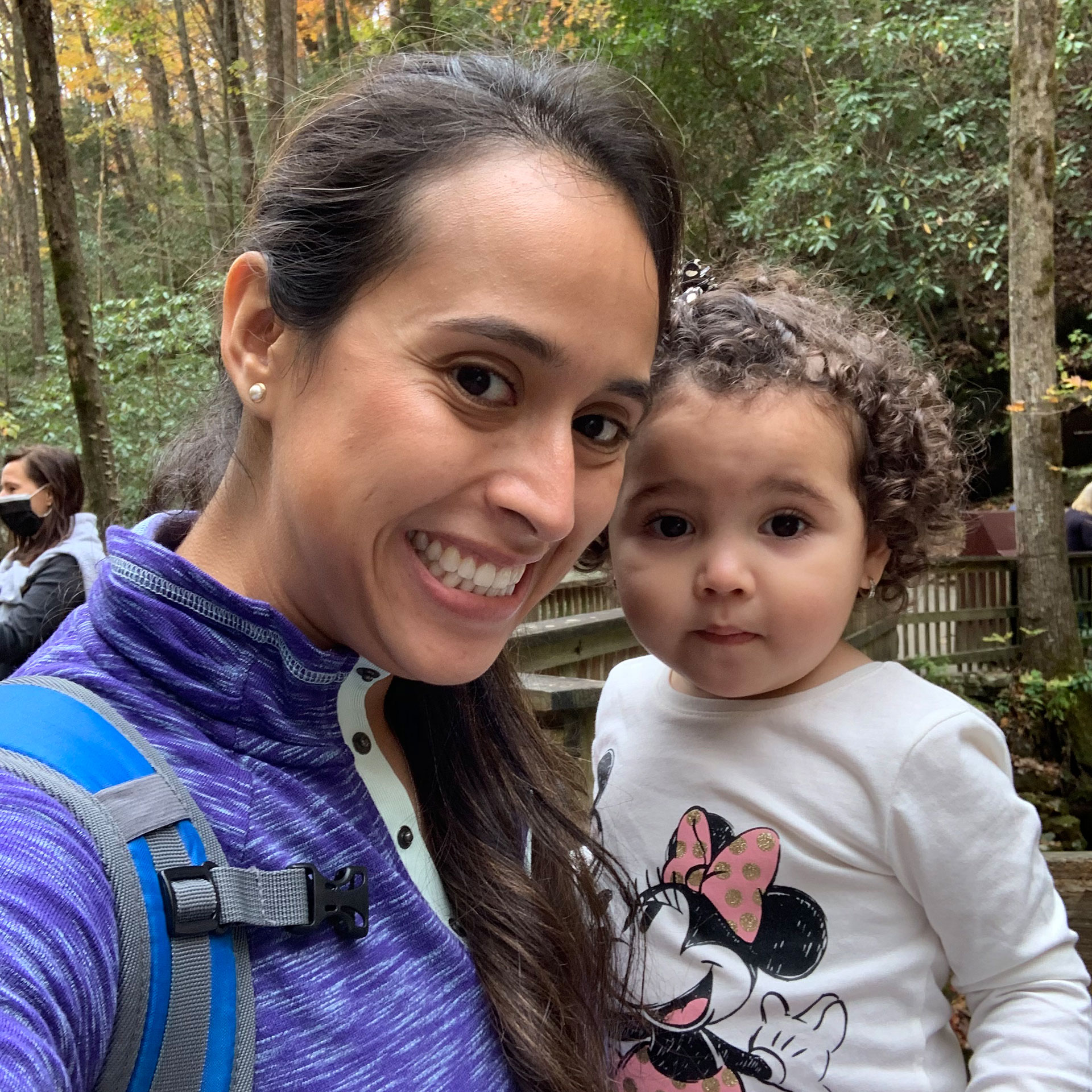 Featured author, Andrea Beltran (left), poses with her niece (right) surrounded by dropped fall foliage.