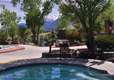 Outdoor pool with view of Sierra Nevada Mountains at David Walley's Resort in Genoa, Nevada.