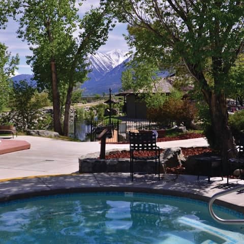 Outdoor pool with view of Sierra Nevada Mountains at David Walley's Resort in Genoa, Nevada.