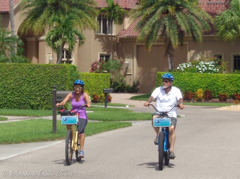 Denise and CJ riding their bikes in a residential neighborhood of Marco Island, Florida