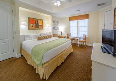 Bedroom with dining area in a two-bedroom presidential villa at Galveston Seaside Resort