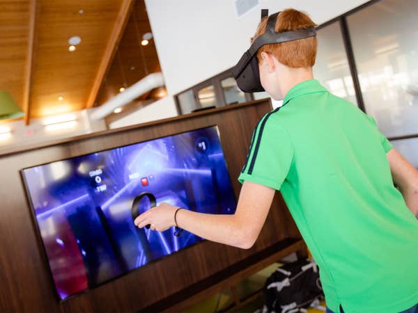 Young child playing virtual reality video game at Scottsdale Resort in Scottsdale, Arizona.