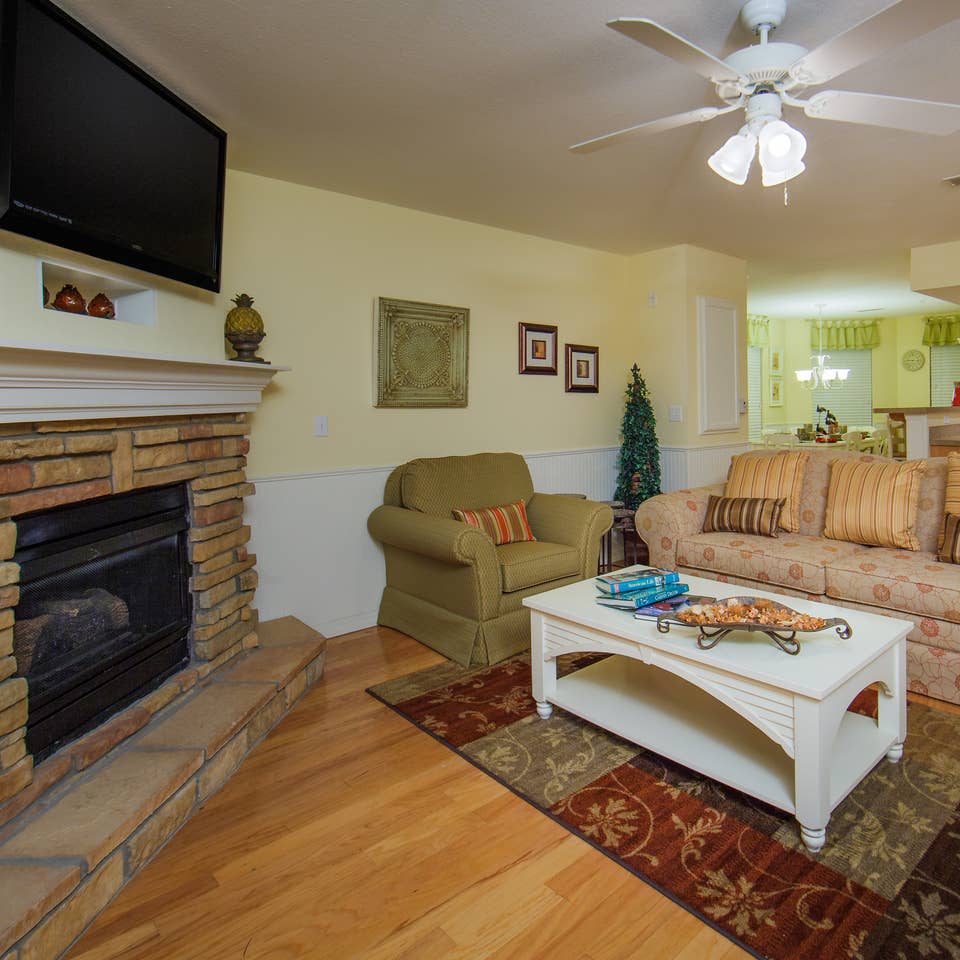 Living room with fireplace in a two-bedroom presidential villa at the Holiday Hills Resort in Branson Missouri.