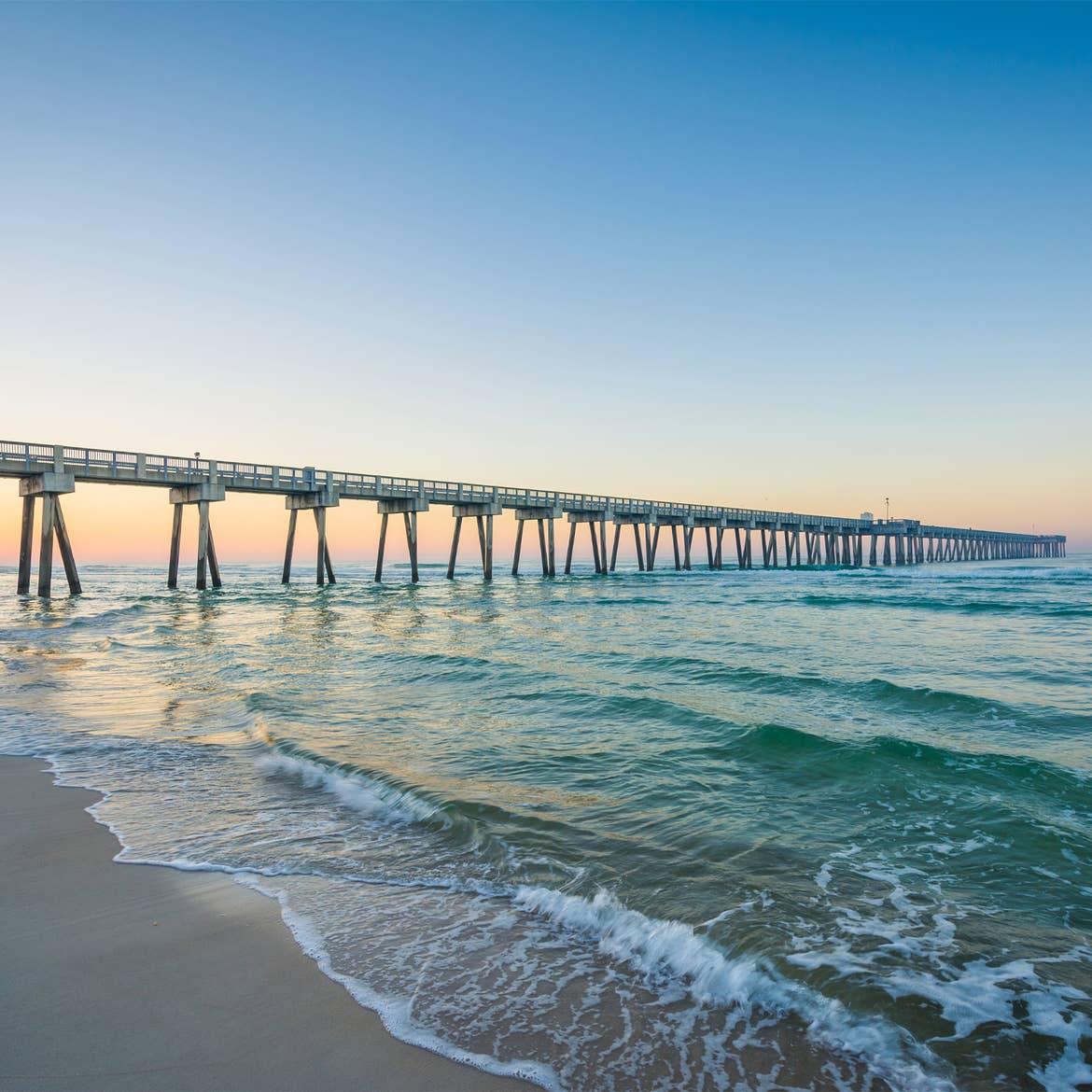 Ocean wave view, overlooking pier.