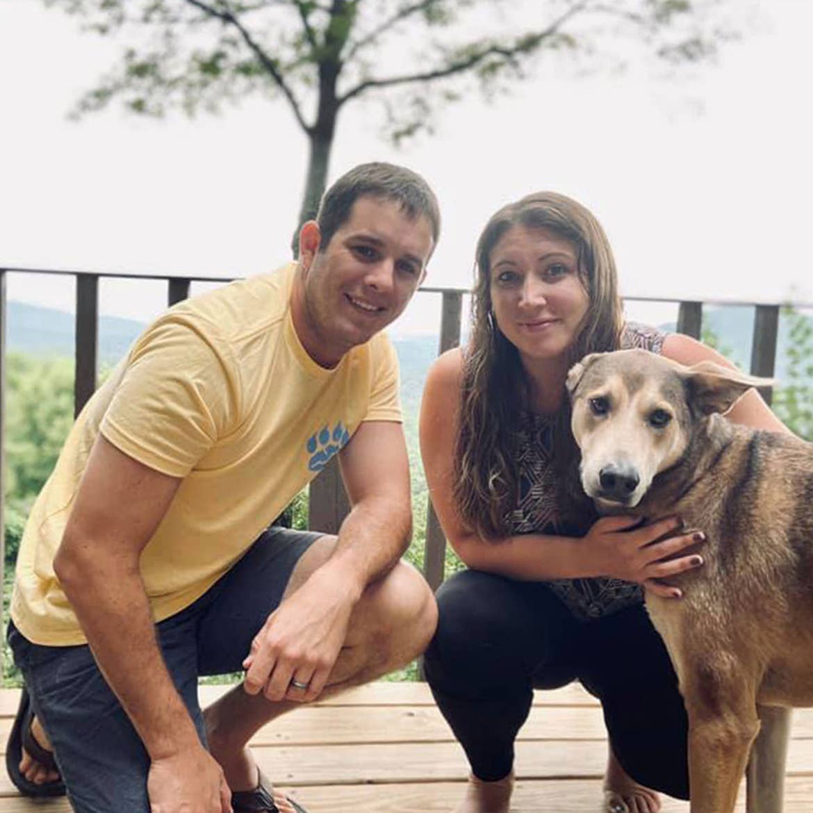 Featured Contributor, Tori Ferrante (right) and her husband (left) enjoy some quality time with their hound, Deagon.