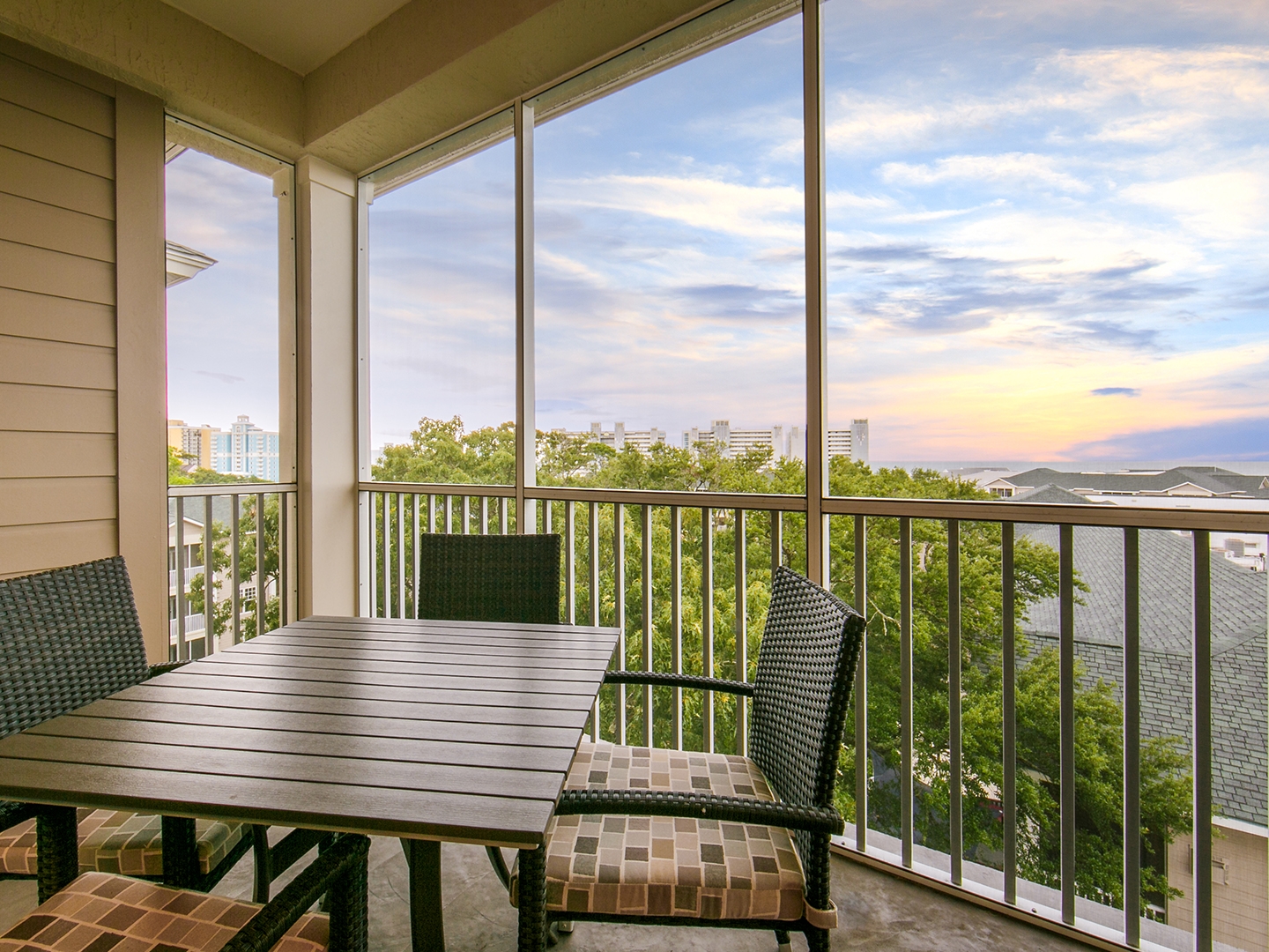 Balcony with outdoor furniture in a three-bedroom Signature Collection villa at South Beach Resort in Myrtle Beach, South Carolina.
