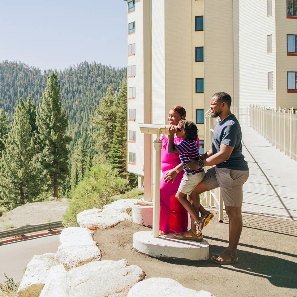 a family overlooking Lake Tahoe