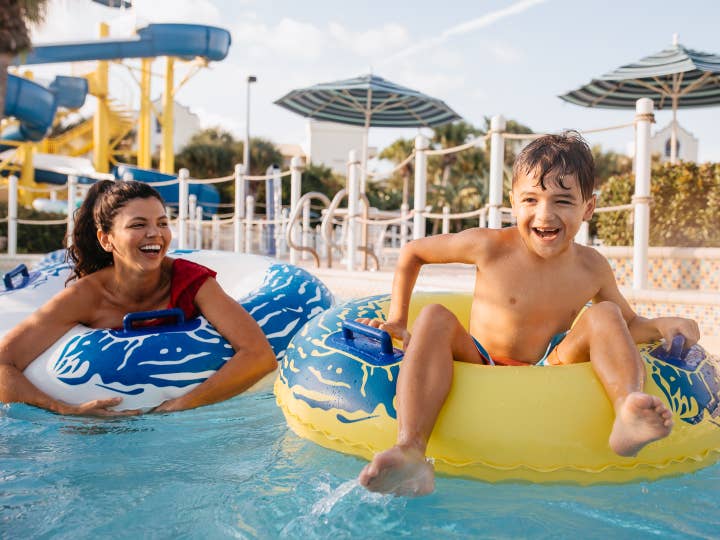 Mother and son in lazy river at Cape Canaveral Beach Resort in Florida.