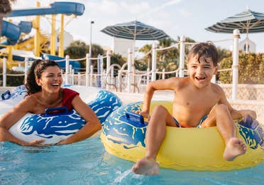 Mother and son in lazy river at Cape Canaveral Beach Resort in Florida.