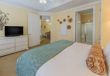 Bedroom in a two-bedroom presidential villa with a view of the bathroom at Apple Mountain Resort in Clarkesville, GA