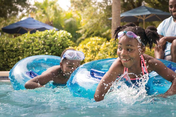Young kids playing in lazy river at Orange Lake Resort near Orlando, Florida
